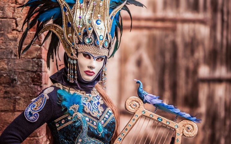 Woman with String Instrument Wearing Attractive Golden and Blue Costume at Venice Carnival