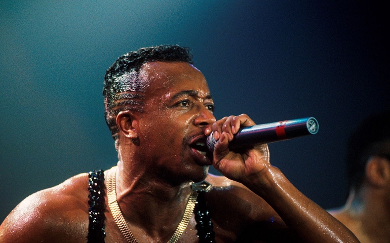 MC Hammer performs on stage in London, 1990.