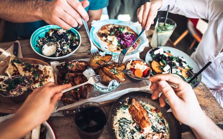Happy people sharing their healthy lunch