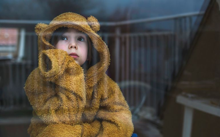 Sad child in isolation at home