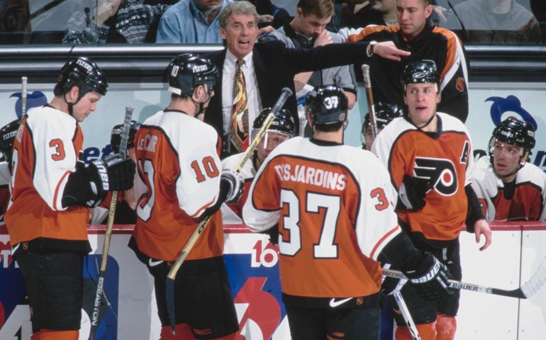 Roger Neilson, Head Coach for the Philadelphia Flyers points out instructions to the team from the bench during the NHL Eastern Conference Northeast Division game against the Ottawa Senators on 20th February 1999 at the Corel Centre arena in Ottawa, Ontario, Canada. The Ottawa Senators won the game 4 - 1. (Photo by Robert Laberge/Allsport/Getty