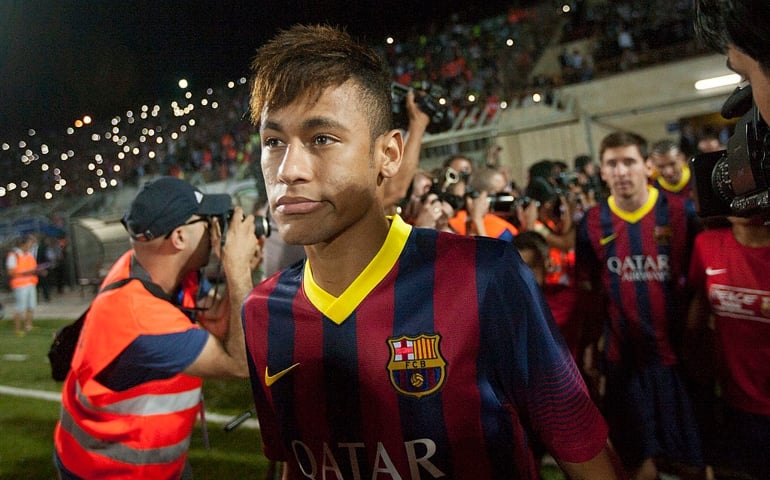 HEBRON, WEST BANK - AUGUST 03: Neymar of FC Barcelona takes part in a football clinic with local Palestinian children at the Dura Stadium on August 3, 2013 in Hebron, West Bank. Members of the FC Barcelona squad have travelled to the Middle East to visit Israel and the West Bank as part of a two-day 'peace tour'.