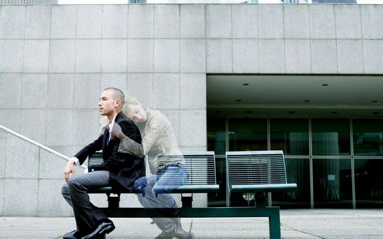 'Ghost' of woman embracing young man on bench (Digital Composite)