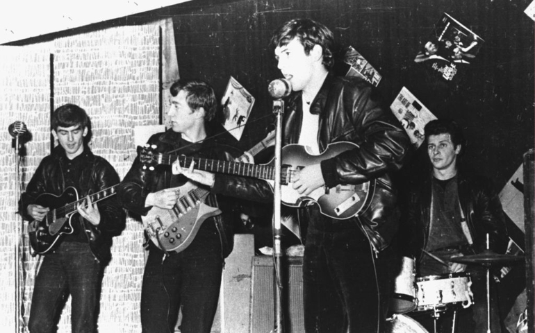 British rock group The Beatles perform in a club prior to signing their first recording contract, Liverpool, England, 1962. L-R: George Harrison, John Lennon, Paul McCartney, and original drummer Pete Best.