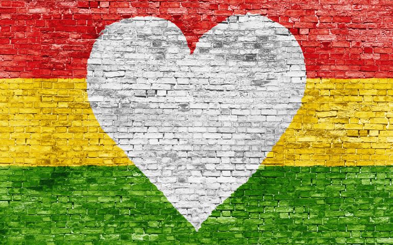 Love for reggae music loving painted over white brick wall