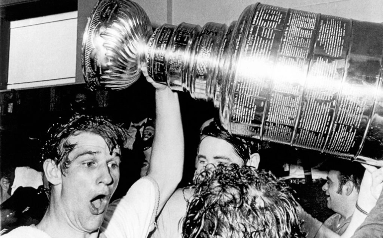 Boston Bruins star Bobby Orr whoops and holds up the Stanley Cup after he scored the winning goal in overtime against the St Louis Blues at the Boston Garden, Boston, Massachusetts, May 10, 1970. Boston won the hockey playoff championship for the first time in 29 years.