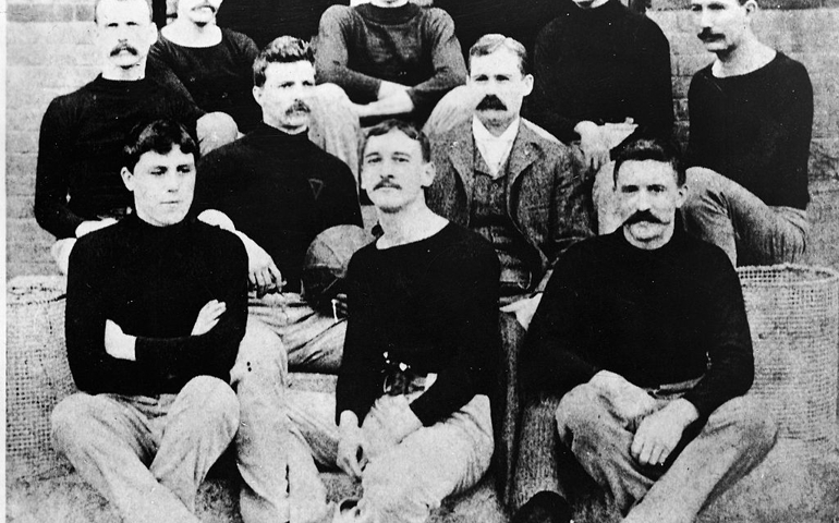 Portrait of Canadian physician and teacher Dr. James Naismith (1861 - 1939), inventor of the game of basketball, with his first basketball team, Springfield, Massachusetts, 1891. Naismtih invented the game as an indoor wintertime diversion for the football players.