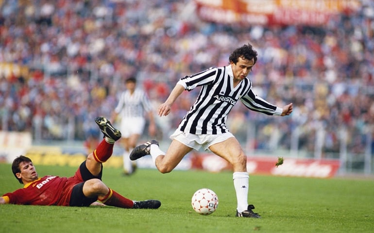 ROME, ITALY - APRIL 01: Sebastiano Nela (left) of AS Roma attempts to tackle Michel Platini of Juventus during a Seria A match in the 1985/86 season at the Olympic Stadium in Rome, Italy.