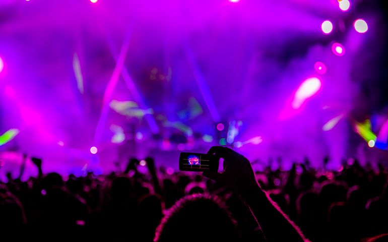 music performance with lasers and bright lights