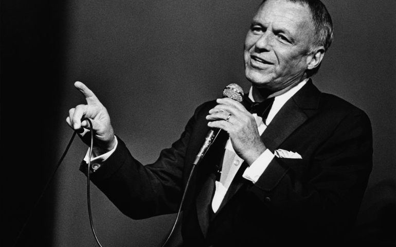 Singer Frank Sinatra belts out a song during a 1980 Universal City, California, performance at the Universal Amphitheatre.