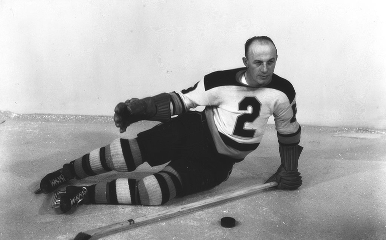 UNITED STATES - CIRCA 1930: Famous Boston Bruins star Eddie Shore poses for a photo on the ice in Boston Garden around 1930. (