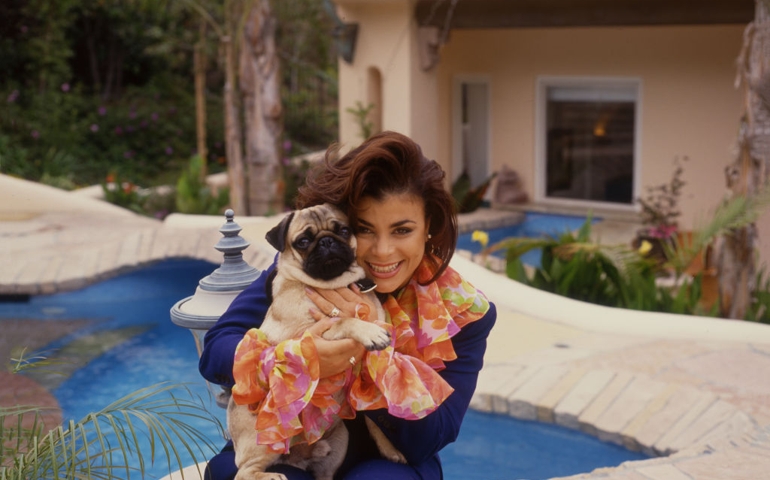 American singer Paula Abdul, portrait, by a swimming pool, United States, 1990.