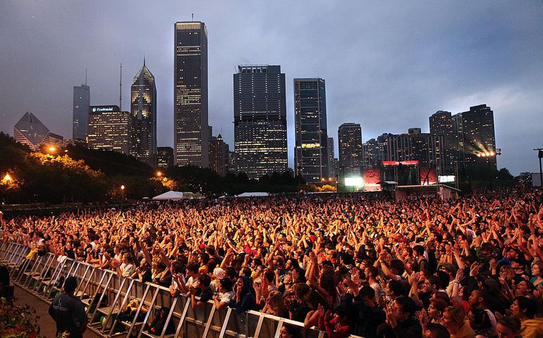 Fans watch the performance of Andrew Bird during the 2009 Lollapalooza Music Festival at Grant Park on August 7, 2009.