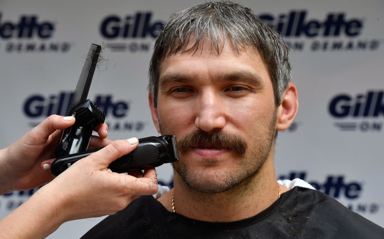 MCLEAN, VA - JUNE 13: With the help of a barber, World Champion hockey star Alex Ovechkin gets his "playoff beard" trimmed down with a clipper before completing his clean-shaven postseason look with a Gillette Fusion ProShield Razor on June 13, 2018 in Mclean, Virginia.