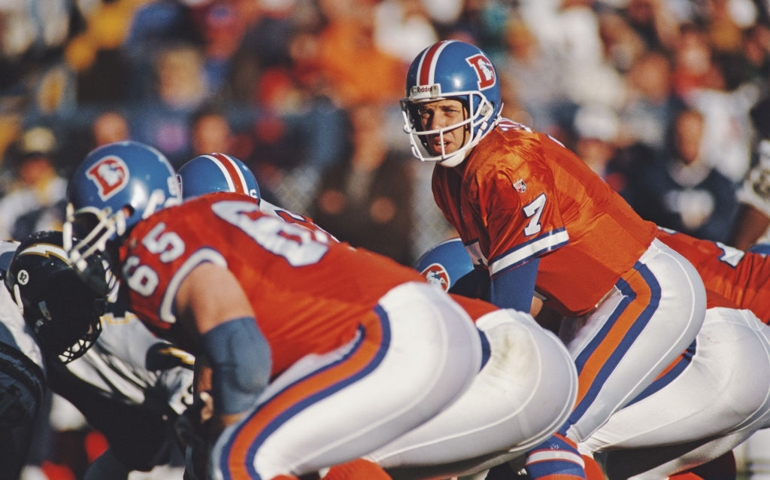 John Elway #7, Quarterback for the Denver Broncos calls the play on the line of scrimmage during the American Football Conference West game against the San Diego Chargers on 19 November 1995 at the Mile High Stadium, Denver, Colorado,United States. The Chargers won the game 27 - 30.