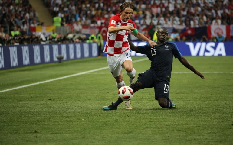 Luka Modric of Croatia, left, plays past N'Golo Kante of France during the FIFA World Cup final match in Moscow, Russia, on Sunday, July 15, 2018. President Vladimir Putin spent six years and more than $11 billion preparing nearly a dozen Russian cities to host the soccer World Cup, the biggest such event the country's held since the collapse of the Soviet Union.