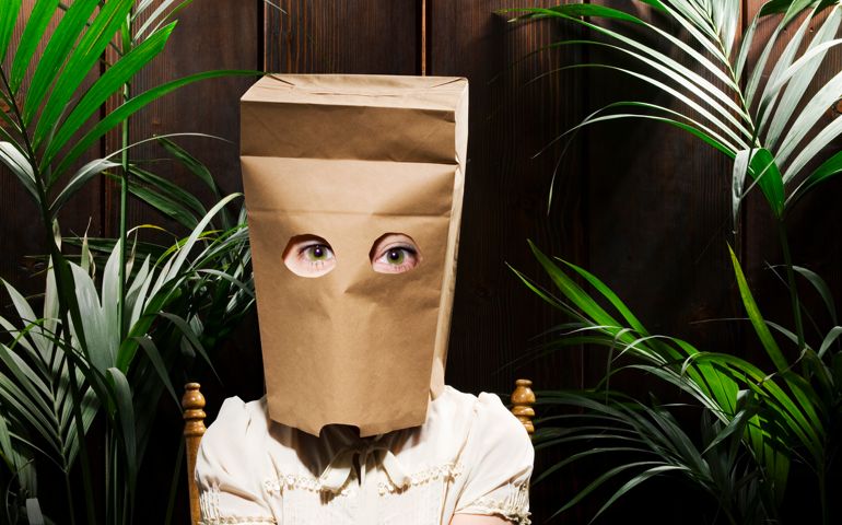 Woman with paper bag on head (Digital Composite)