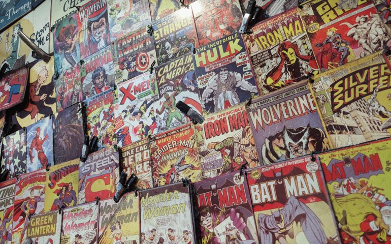 Color comics adverts on a window shop in London, England