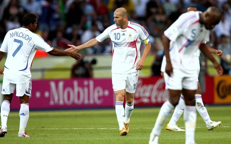 Zinedine Zidane celebrates after scoring from the penalty spot with Malouda during the 2006 FIFA World Cup Germany Final Italy v France