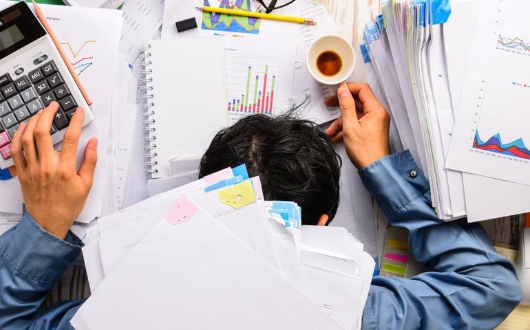 Businessman heavy workload sleep at office desk