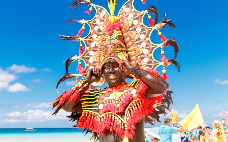 Boracay, Philippines. Festival Ati-Atihan. Unidentified people on parade in carnival costumes
