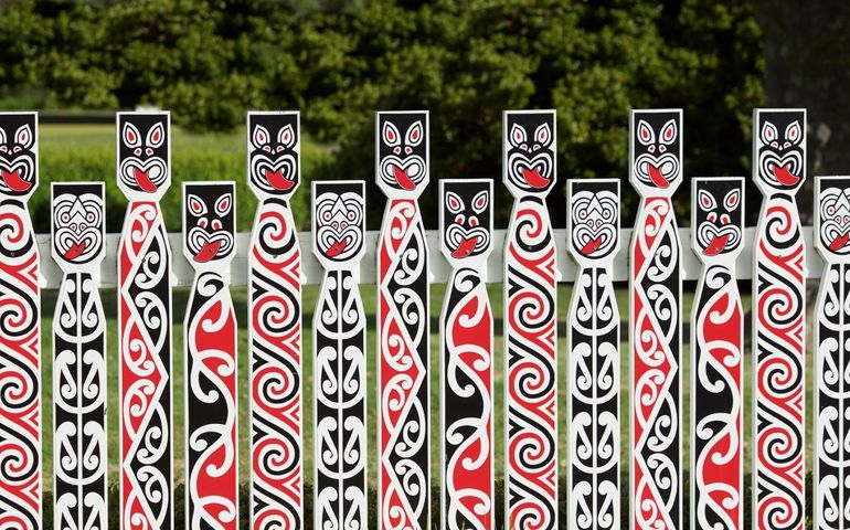 Traditional Maori carving at Whakarewarewa marae (meeting ground) in Rotorua, New Zealand. Maori art detail photo. Maori culture