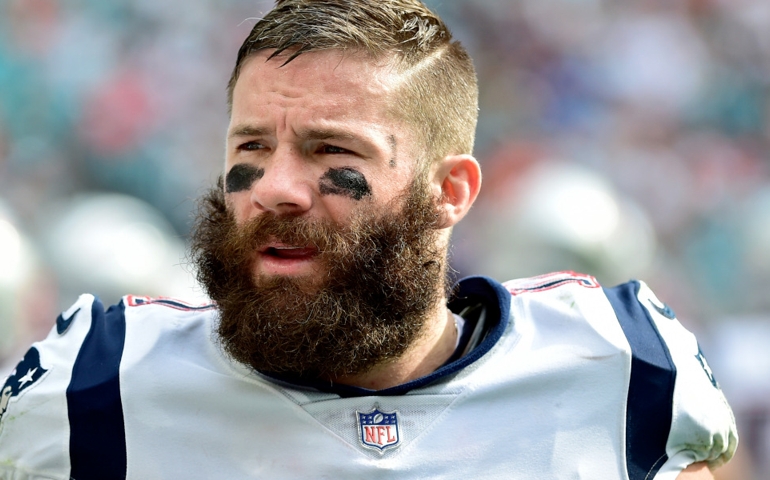 Dec 9, 2018; Miami Gardens, FL, USA; New England Patriots wide receiver Julian Edelman (11) talks with teammates on the sideline during the first half against the Miami Dolphins at Hard Rock Stadium