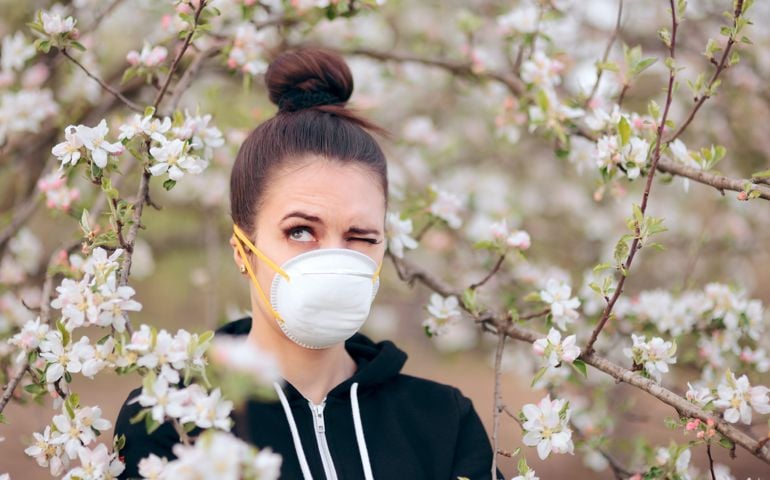 Funny girl trying to protect herself from pollen and allergens