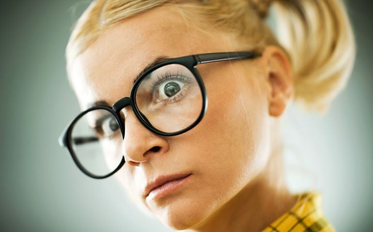 Blonde young woman with a cross expression on her face.