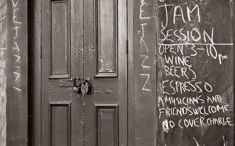 Entrance door of a run down jazz bar. England, 2011