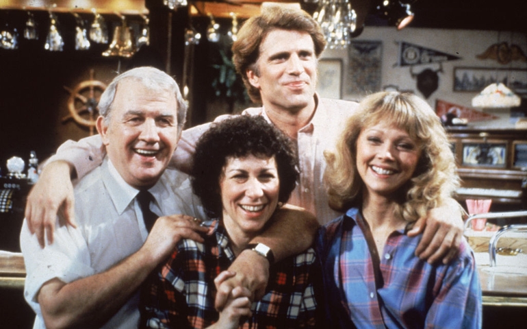Portrait of actors from the TV series, 'Cheers,' on the barroom set, 1983. L-R: Nicholas Colasanto (1924 - 1985), Rhea Perlman, Ted Danson and Shelley Long.