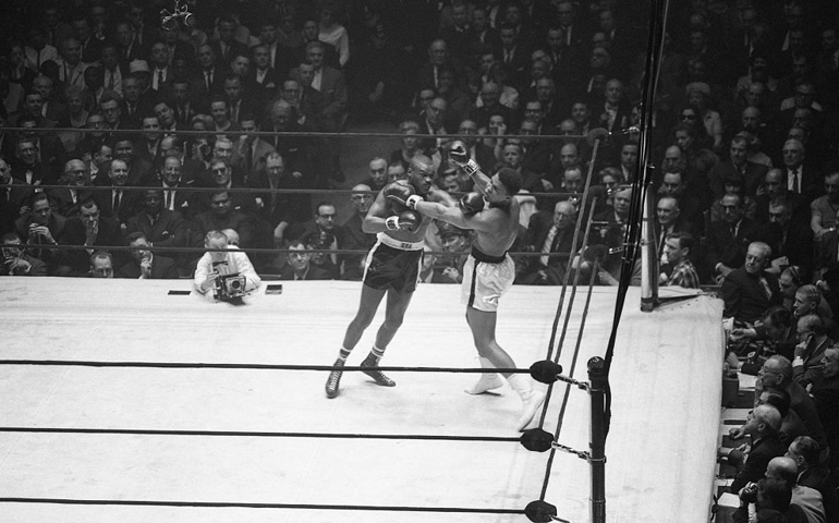 NEW YORK, NY - MARCH 13: Doug Jones (L) lands a hard left on Cassius Clay during their heavyweight bout at Madison Square Garden, New York, New York, March 13, 1963.