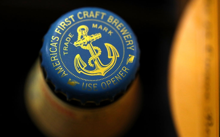 SAN FRANCISCO, CA - AUGUST 03: Bottles of Anchor Steam beer are displayed on a shelf at Coit Liquor on August 3, 2017 in San Francisco, California. San Francisco based Anchor Brewing announced plans to sell to Japan's Sapporo Holdings Ltd for an undisclosed amount. Anchor Steam has brewed in San Francisco for 121 years.
