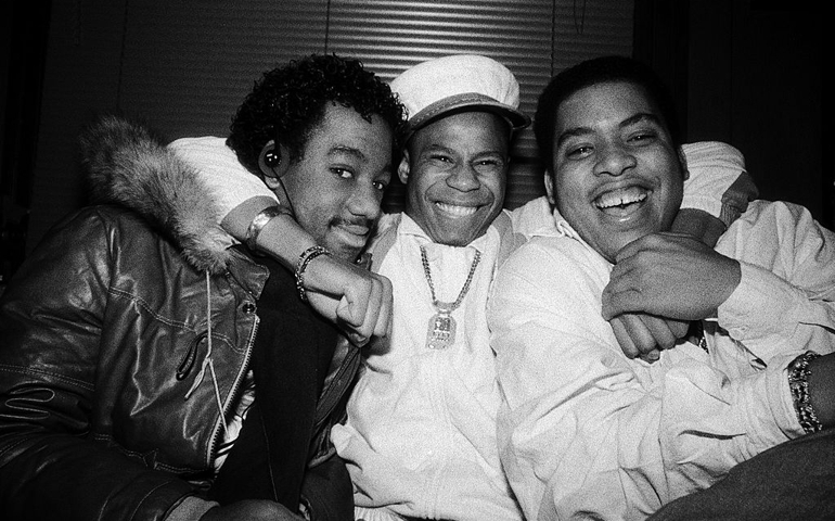 NEW YORK - NOVEMBER 21: American rapper Doug E. Fresh (born Douglas E. Davis, aka the Human Beat Box) center, and the Get Fresh Crew (Barry Bee and Chill Will) laugh and pose for a portrait on November 21,1986 in Harlem, New York City, New York.