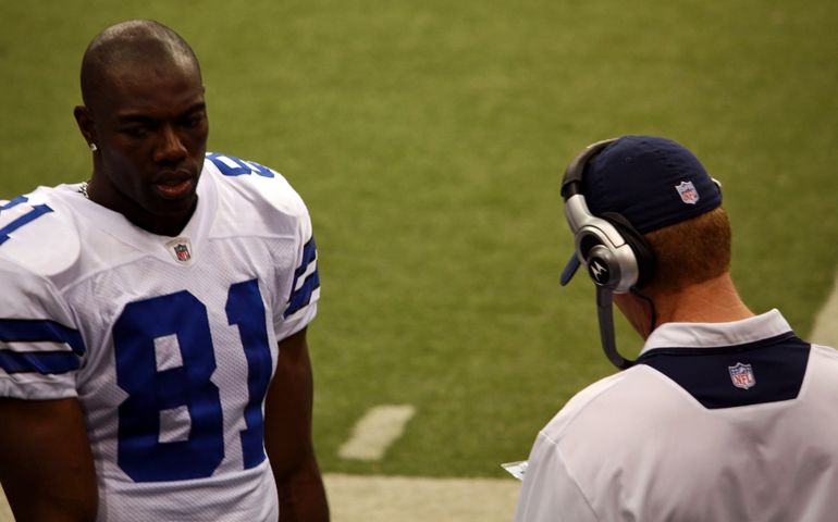Dallas Cowboys receiver Terrell Owens and coach Jason Garrett on the sideline during a game with the NY Giants