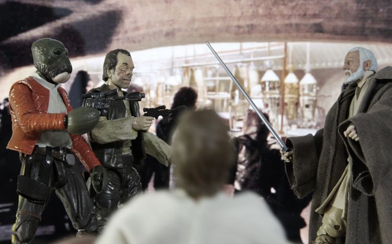 Recreation of a scene from Star Wars A New Hope in the Mos Eisley Cantina where Ben Kenobi confronts Dr Evazan and Ponda Baba cutting off Ponda's arm with his lightsaber