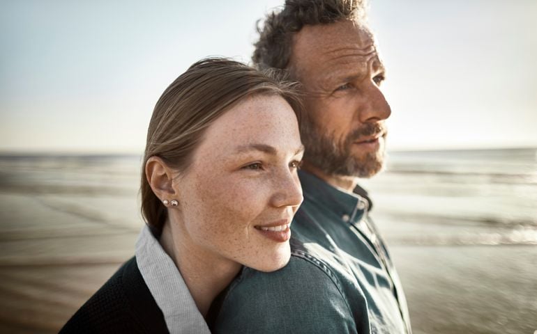 Portrait of man and young woman by the sea