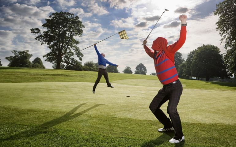 Two golfers celebrating