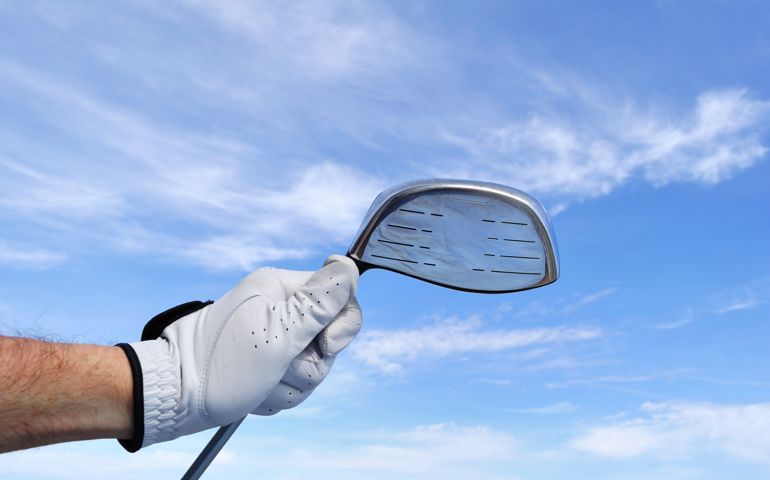 Golfer Holding a Metal Driver