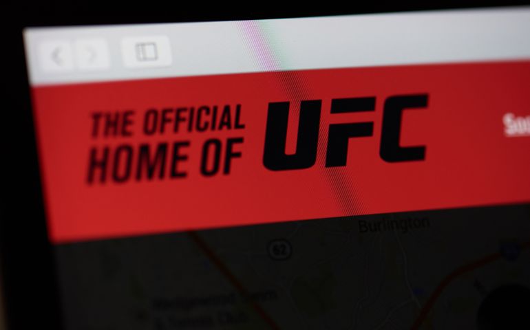 Official UFC home page on laptop screen close up view
