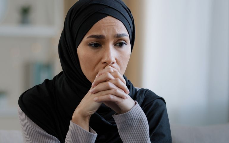 Upset sad girl in hijab sit alone get bad news feel depressed frustrated muslim woman suffering from illness worried about unresolved problems feeling sorrow grief hard divorce need psychological