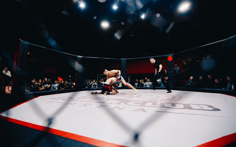 Boxers fighters fight in fights without rules in the ring octagon