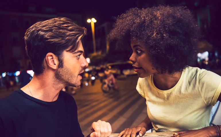 Close-up of angry couple arguing at date night