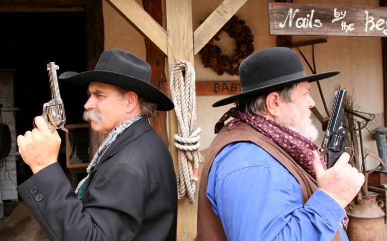 Two cowboys prepare to duel.