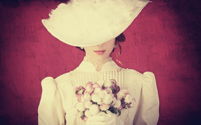 Beautiful redhead women with bouquet