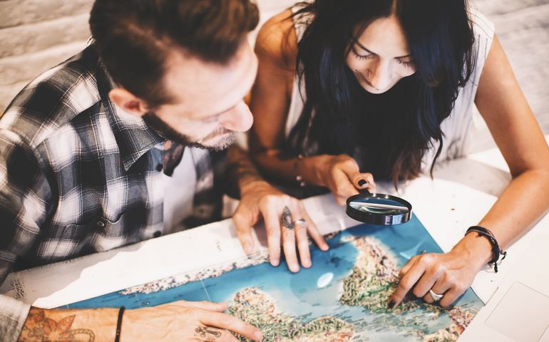 Young couple in love planning a trip