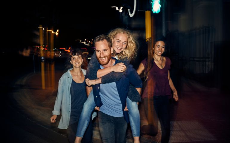 Group of young people having fun at night