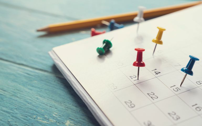 close up of calendar on the table, planning for business meeting or travel planning concept