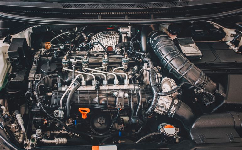 Open hood on diesel engine modern car in detail