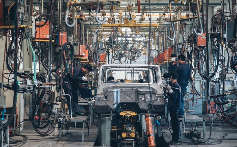 Workers in an automoble factory in Beijing,China.